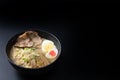 Delicious tonkotsu ramen, Japanese noodle in pork Bone based soup topped with chashu pork, boiled egg, pickled bamboo shoot