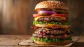Delicious towering stack of various hamburgers with fresh ingredients Royalty Free Stock Photo