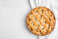 Delicious traditional apple pie on white table, top view. Space for text Royalty Free Stock Photo