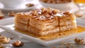 Delicious Traditional Baklava with Honey and Nuts on White Plate, Sweet Mediterranean Dessert Concept