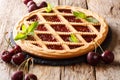 Delicious traditional berry cherry pie Crostata close-up. horizontal, rustic