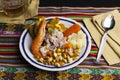 Delicious traditional Peruvian ceviche plated with beer. Royalty Free Stock Photo