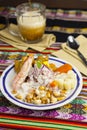 Delicious traditional Peruvian ceviche plated with beer. Royalty Free Stock Photo