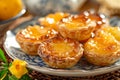 Delicious Traditional Portuguese Egg Tart Pastries on Plate with Citrus Decorations