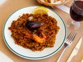 Valencian seafood paella with shrimps, squid and clams Royalty Free Stock Photo