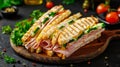 Delicious triangle sandwich with ham, cheese, tomato, and fresh salad ingredients Royalty Free Stock Photo