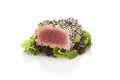 Delicious tuna steak on green salad