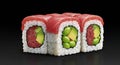 Delicious tuna sushi rolls with avocado and edamame on black background Royalty Free Stock Photo