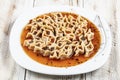 Delicious Turkish Ravioli Tepsi Manti. Turkish traditional Kayseri Tepsi Manti manlama Royalty Free Stock Photo