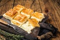 Delicious Turkish Tray pastry, Su boregi with cheese. Wooden background. Top view