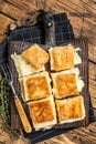 Delicious Turkish Tray pastry, Su boregi with cheese. Wooden background. Top view