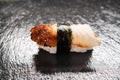 Delicious unagi eel nigiri sushi on black background. Eel Sushi. Traditional Japanese cuisine