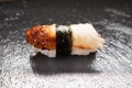 Delicious unagi eel nigiri sushi on black stone background. Eel Sushi. Traditional Japanese cuisine