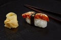 Delicious Unagi Eel Nigiri Sushi Eel Sushi on black background. Traditional Japanese cuisine Royalty Free Stock Photo