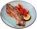 Delicious uruguayan style churrasco steak served with eggplant and pimento pepper