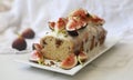 Delicious vanilla bean Tea Cake with cinnamon-hazelnut crumble, glazed with mascarpone vanilla cream and figs Royalty Free Stock Photo