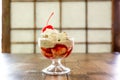 Delicious vanilla ice cream sundae topped with cherry Royalty Free Stock Photo