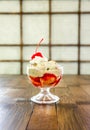 Delicious vanilla ice cream sundae topped with cherry Royalty Free Stock Photo