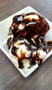 Delicious vanilla ice cream topped with chocolate sauce Royalty Free Stock Photo