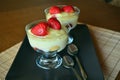 Delicious vanilla puding in glass with fresh strawberry