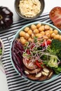 Delicious vegan bowl with broccoli, red cabbage and chickpeas on white table, flat lay Royalty Free Stock Photo