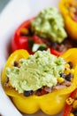 Delicious vegan stuffed bell peppers with black beans corn and tomatoes