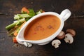 Delicious vegetable and champignon sauce in gravy boat