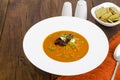 Delicious vegetable cream soup with tomatoes and microgreens.