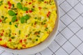 Delicious vegetable omelette served in white plate