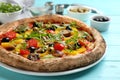 Delicious vegetable pizza on blue wooden table, closeup