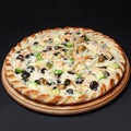 Delicious vegetarian pizza served on a wooden plate isolated on black. Royalty Free Stock Photo