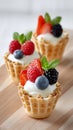 Delicious waffle cups with fresh berries and cream topping Royalty Free Stock Photo