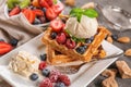 Delicious waffles with berries and ice cream on plate Royalty Free Stock Photo