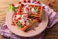 Delicious waffles with berry jam and ice cream on plate Royalty Free Stock Photo