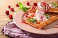 Delicious waffles with berry jam and ice cream on plate Royalty Free Stock Photo