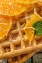 Delicious waffles with orange slices, closeup Royalty Free Stock Photo