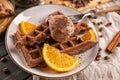 Delicious waffles with orange slices and ice cream on plate Royalty Free Stock Photo