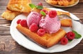 Delicious waffles with raspberries and ice cream on plate Royalty Free Stock Photo