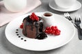 Delicious warm chocolate lava cake with berries on grey table Royalty Free Stock Photo