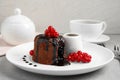 Delicious warm chocolate lava cake with berries on table Royalty Free Stock Photo