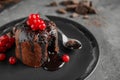 Delicious warm chocolate lava cake with berries on table, closeup Royalty Free Stock Photo