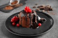 Delicious warm chocolate lava cake with berries on table Royalty Free Stock Photo