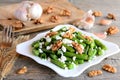 Delicious warm green beans salad with balsamic dressing. Green bean salad with cottage cheese, walnuts, garlic and spices