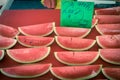 Delicious watermelon slice cuts in cling film with price tags at market stand in Singapore Royalty Free Stock Photo