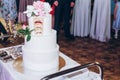 Delicious wedding cake at reception in restaurant with cut slice Royalty Free Stock Photo