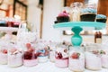 Delicious wedding reception candy bar Dessert table for a wedding party. Cakes with raspberries and strawberry jam Royalty Free Stock Photo