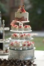 Elegant wedding white decorated cake with roses, festive dessert event decor, with personalized figures