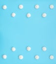 Delicious white merengues on blue background. Happy day, breakfast, good morning concepts. Time for tea or coffee. Greeting or