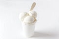 Delicious white vanilla ice cream in paper cup.Totally white shot. Summer time product Royalty Free Stock Photo