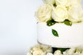 Delicious white wedding cake decorated with flowers Royalty Free Stock Photo